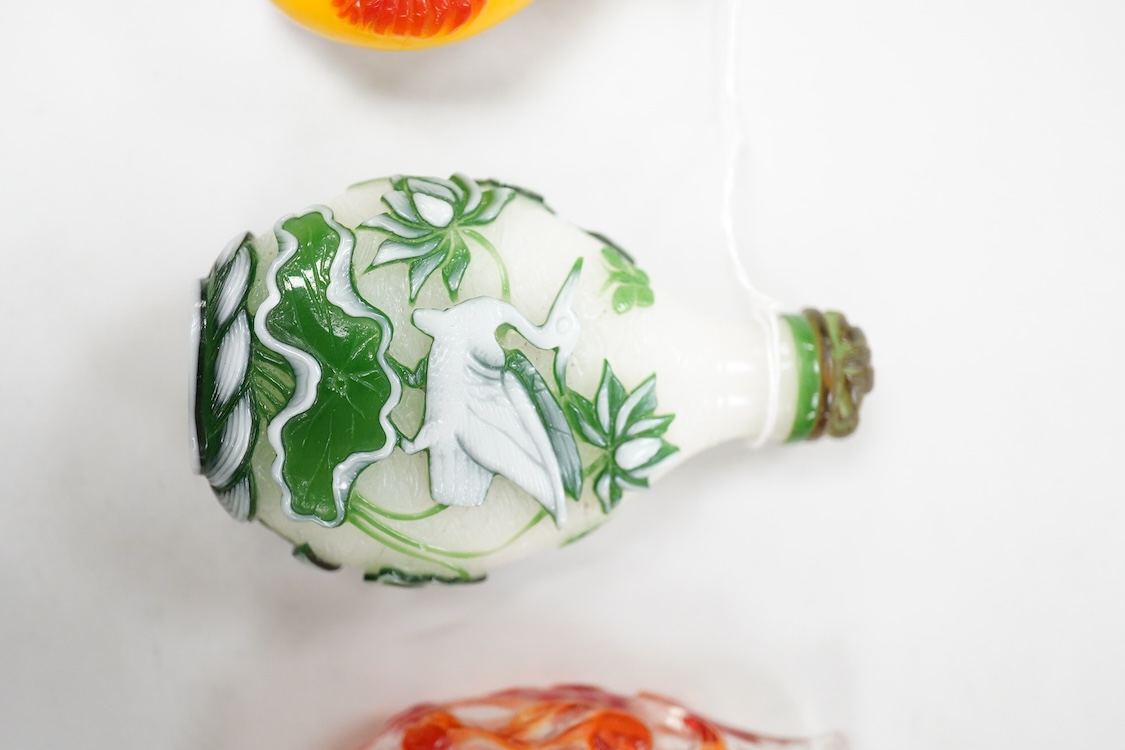 Three Chinese glass snuff bottles and a porcelain snuff bottle(4), tallest 8cm high